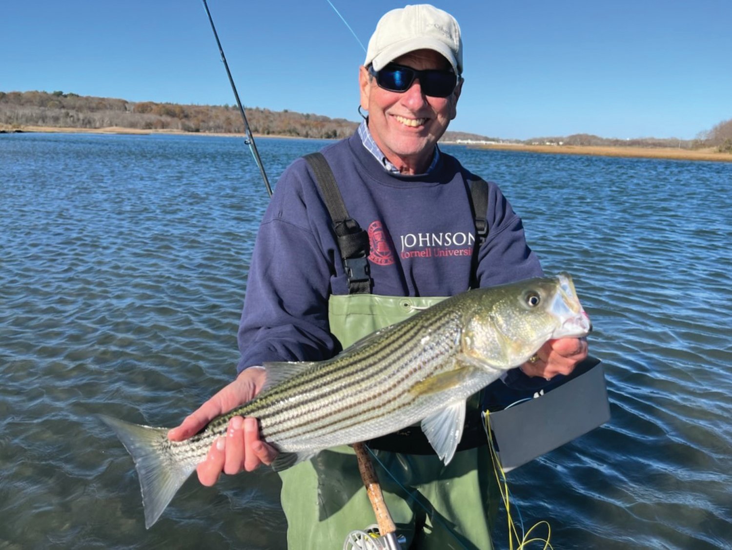 FIRST STRIPED BASS: Capt. Dave Monti with his first ever striped bass caught fly fishing on Narrow River, Narragansett. (Submitted photo)
